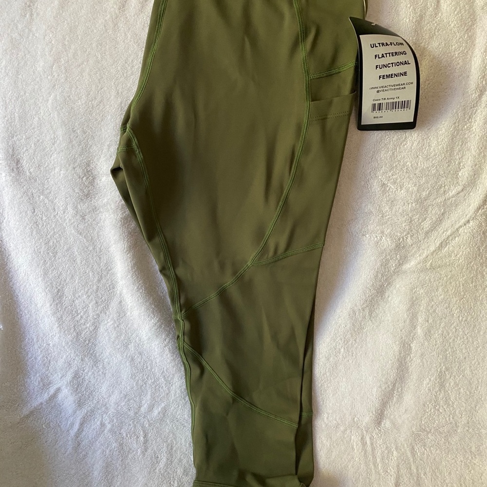 NWT olive color workout capris with accent hem